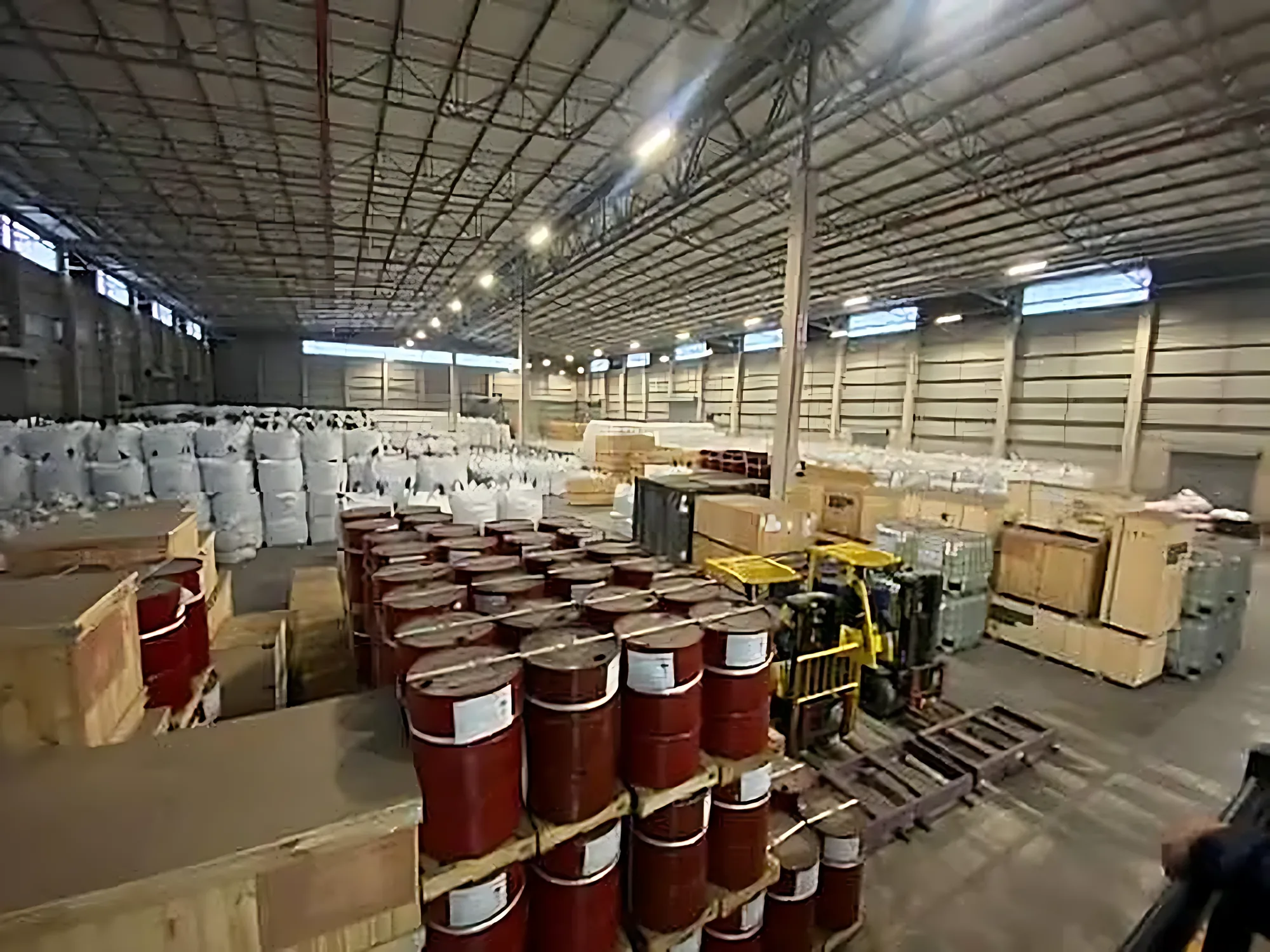 Drums of mining chemicals and reagents stored in a warehouse